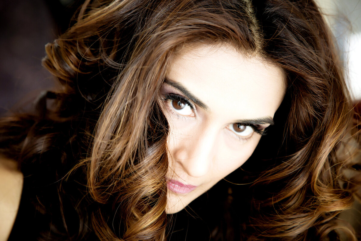 A very close-up image of a  female dating portrait client's face
