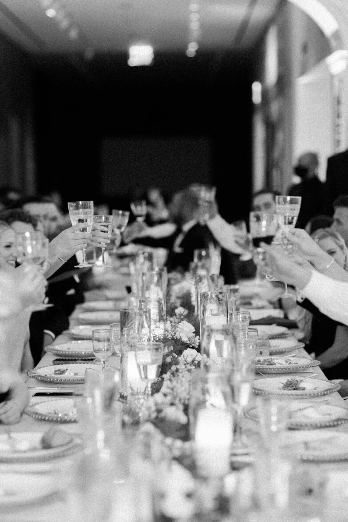 wedding reception clinking glasses