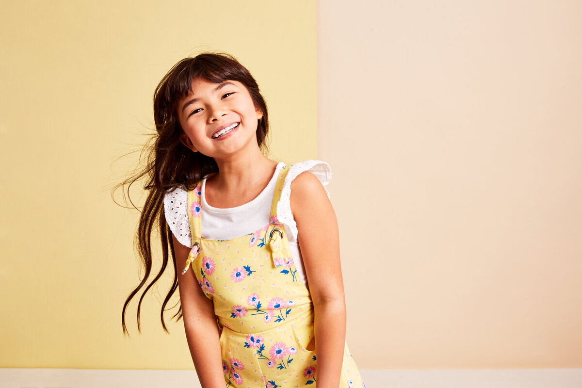 Greer Rivera Photography Kids Editorial Photoshoots Marin CA Girl in flower overalls smiling