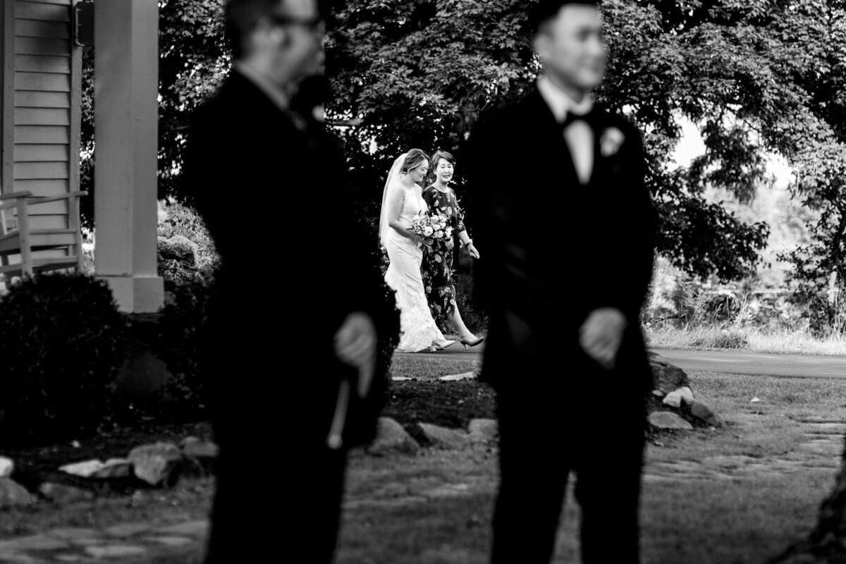 One of the top wedding photos of 2021. Taken by Adore Wedding Photography- Toledo, Ohio Wedding Photographers. This photo is of bride walking down the aisle of her wedding