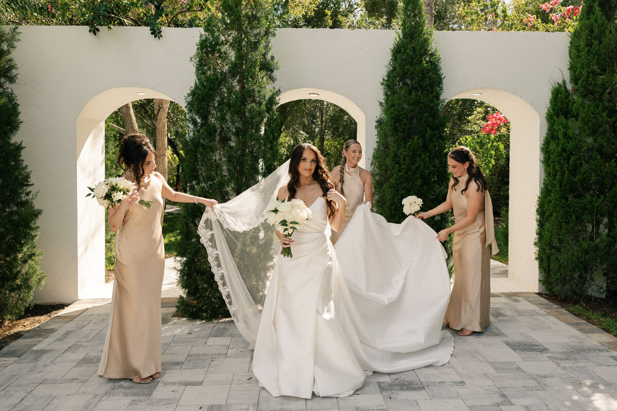 Bridal party portraits with Tuscan-style backdrop at La Casa Toscana
