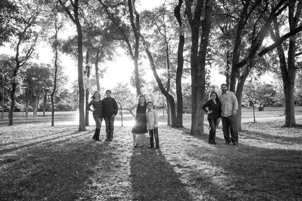 black-and-white-photograph-of-family-in-the-woods