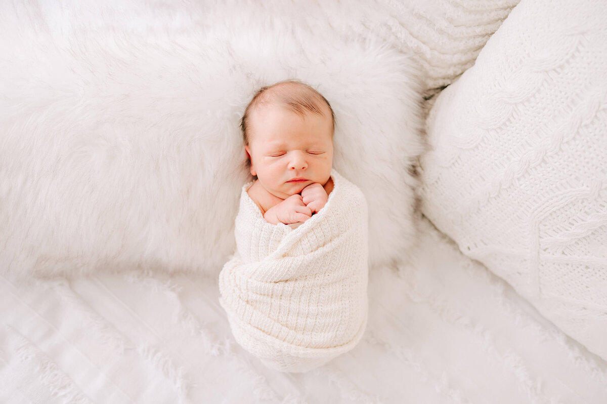 Branson MO newborn photographer captures baby boy swaddled and sleeping