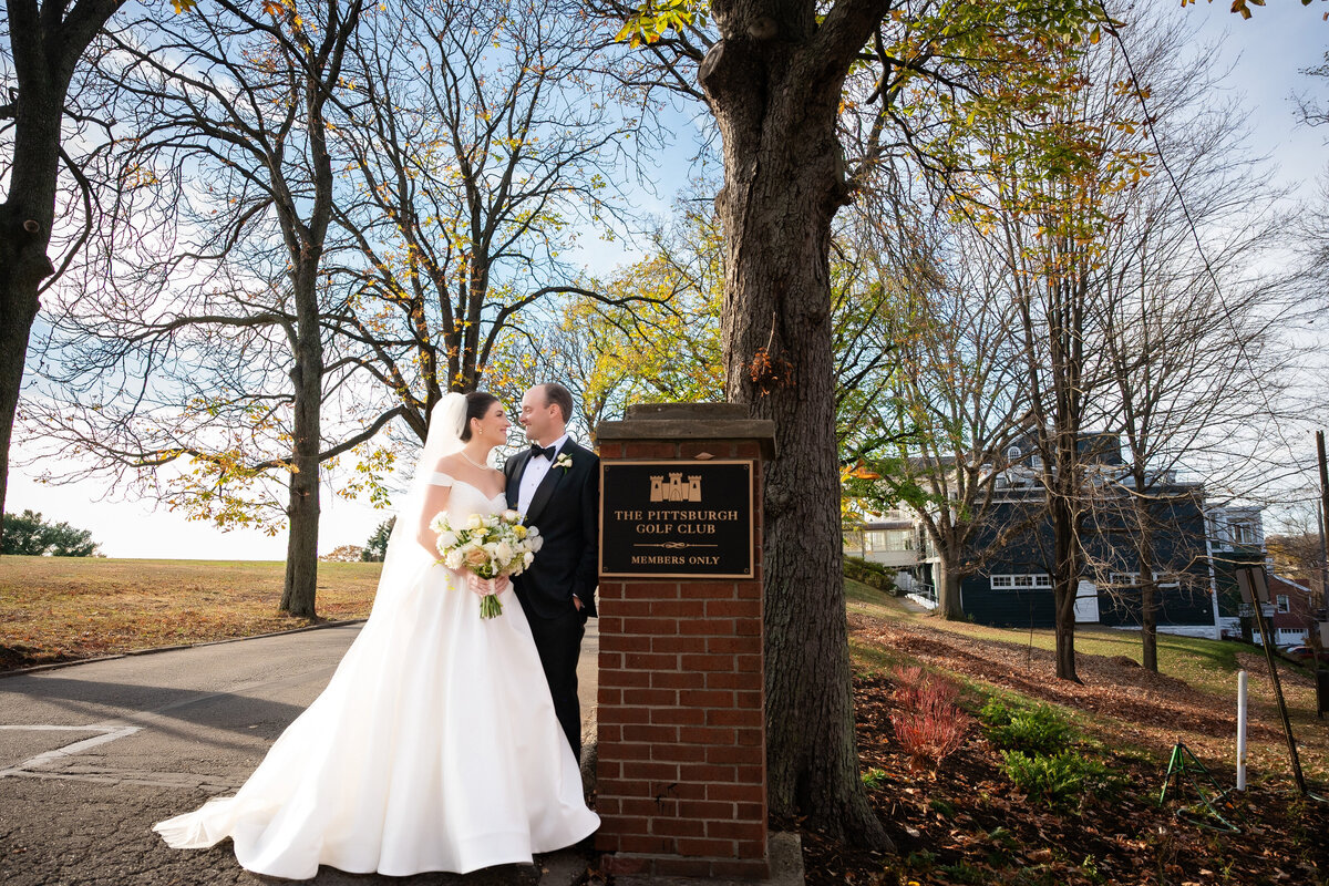 wedding pic in front of pittsburgh golf club