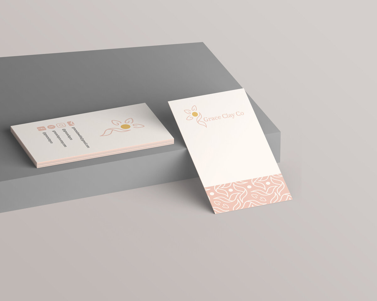 Grace Clay Co earring tags created by Ayanna Richilano Designs displayed sitting on a grey box with a lighter greyish brown backdrop