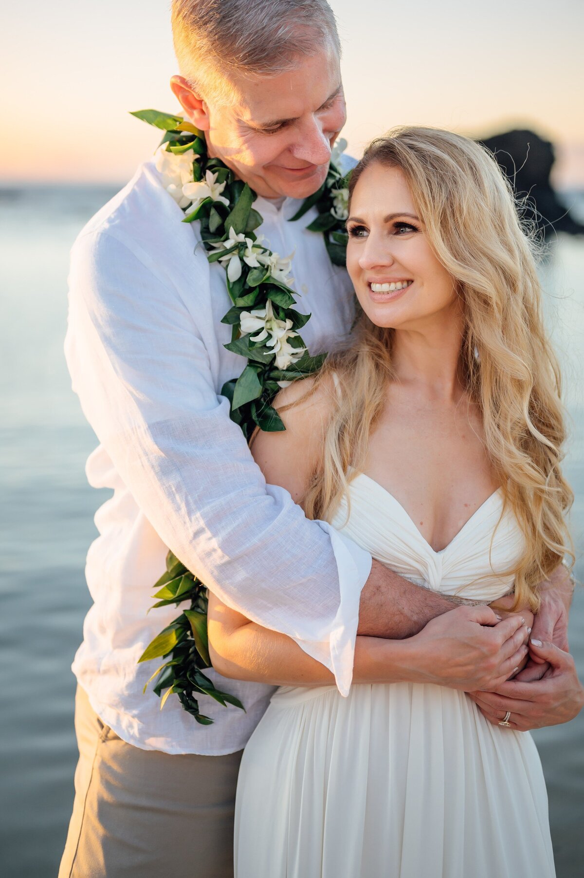 grooms embraces bride