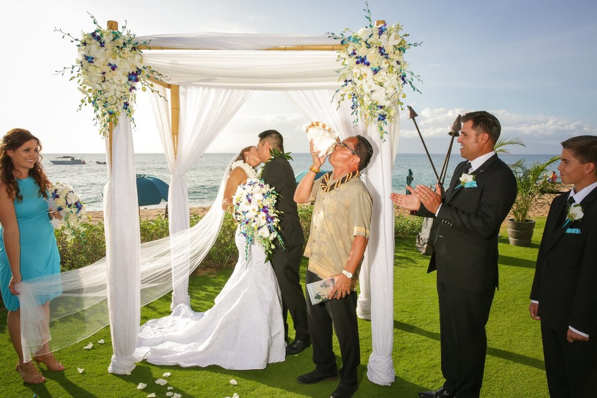 Capture Aloha Wedding Kissing with friends, best man and maid of honor