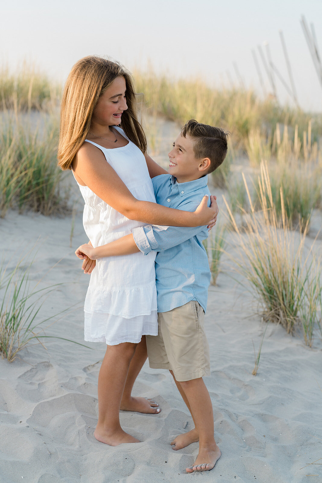 Brother and sister hugging