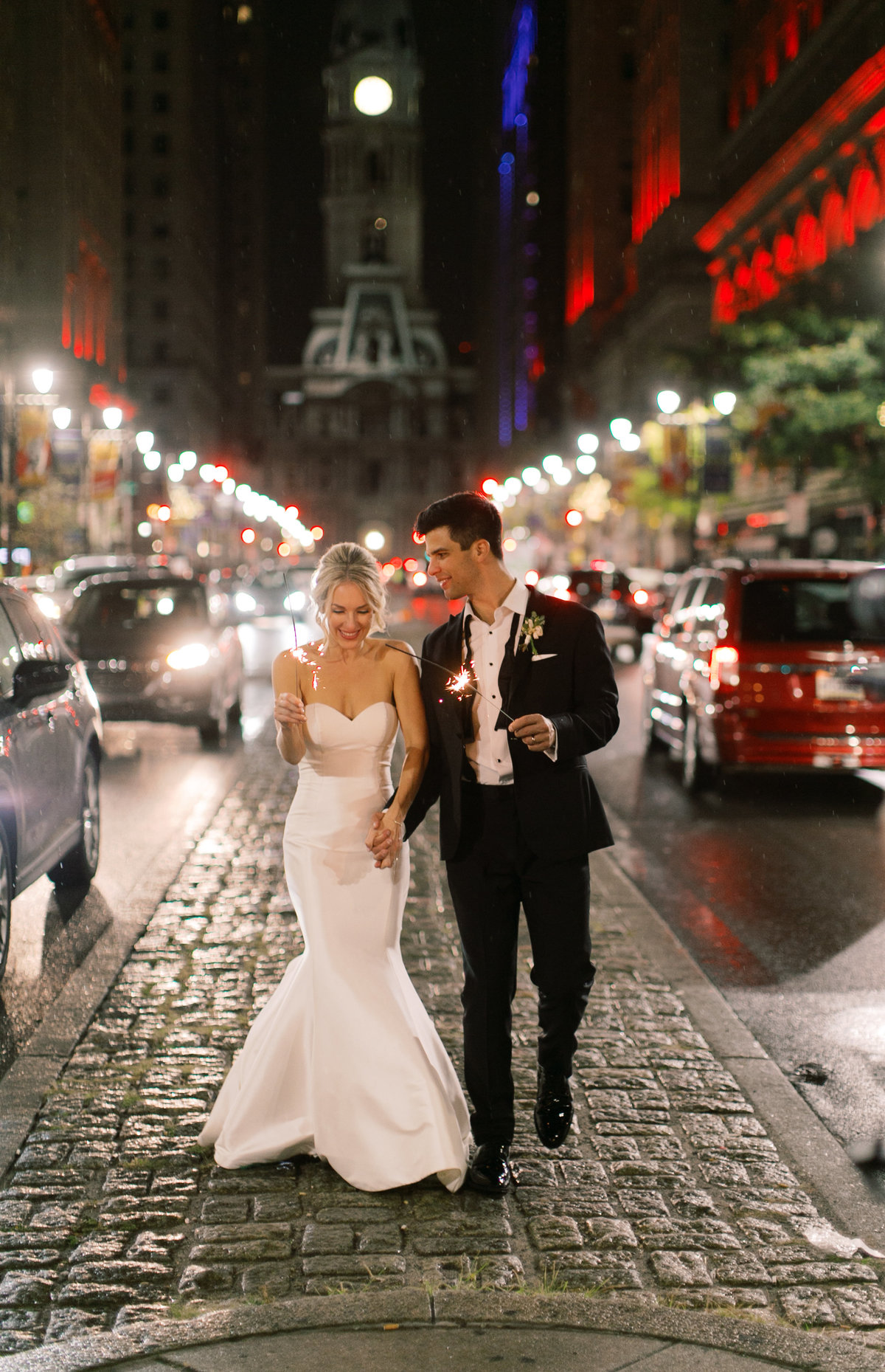 bride and groom walking down cobblestone path