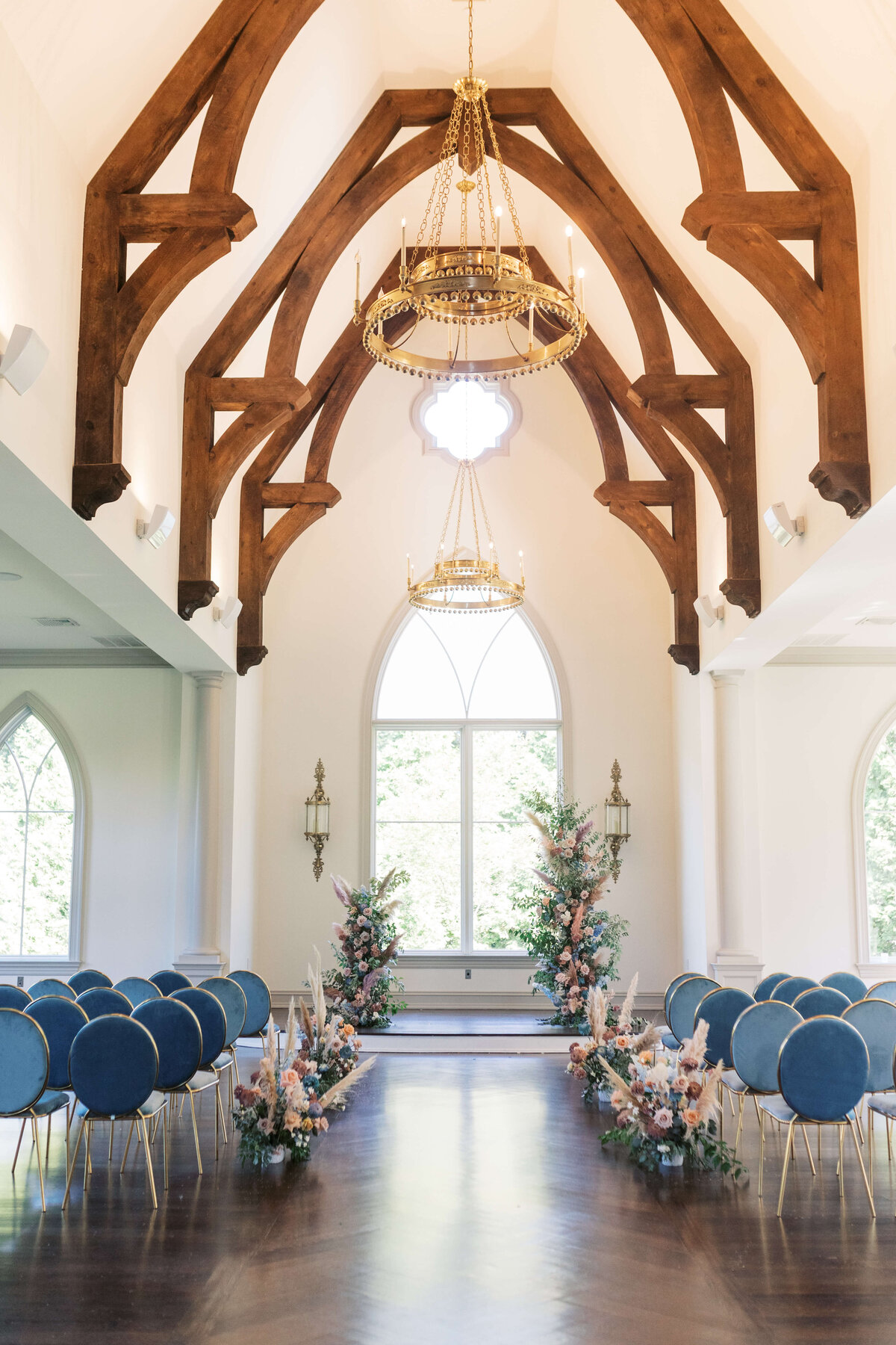 Stunning floral ceremony decor in Park Chateau Chapel.