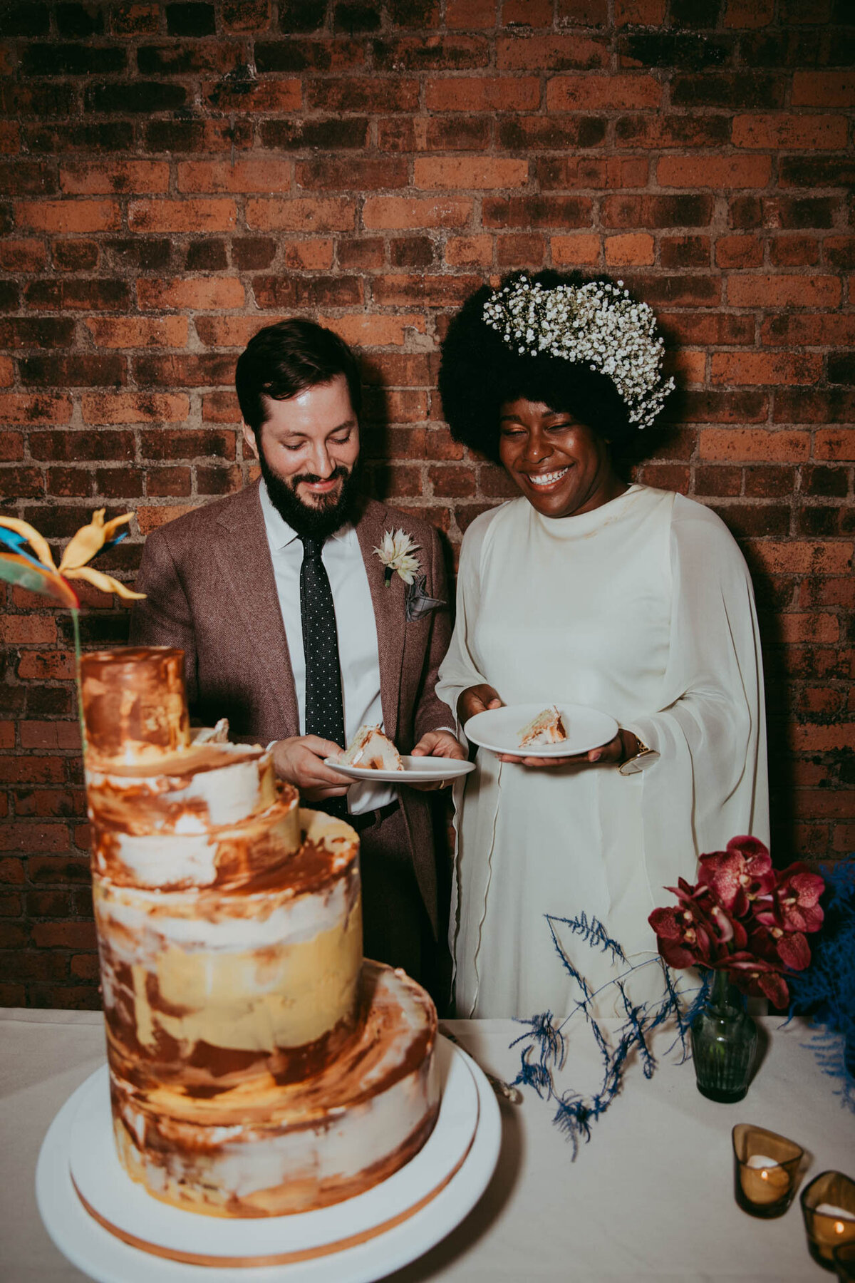 east village jove meyer wedding couple with cake by nine cakes