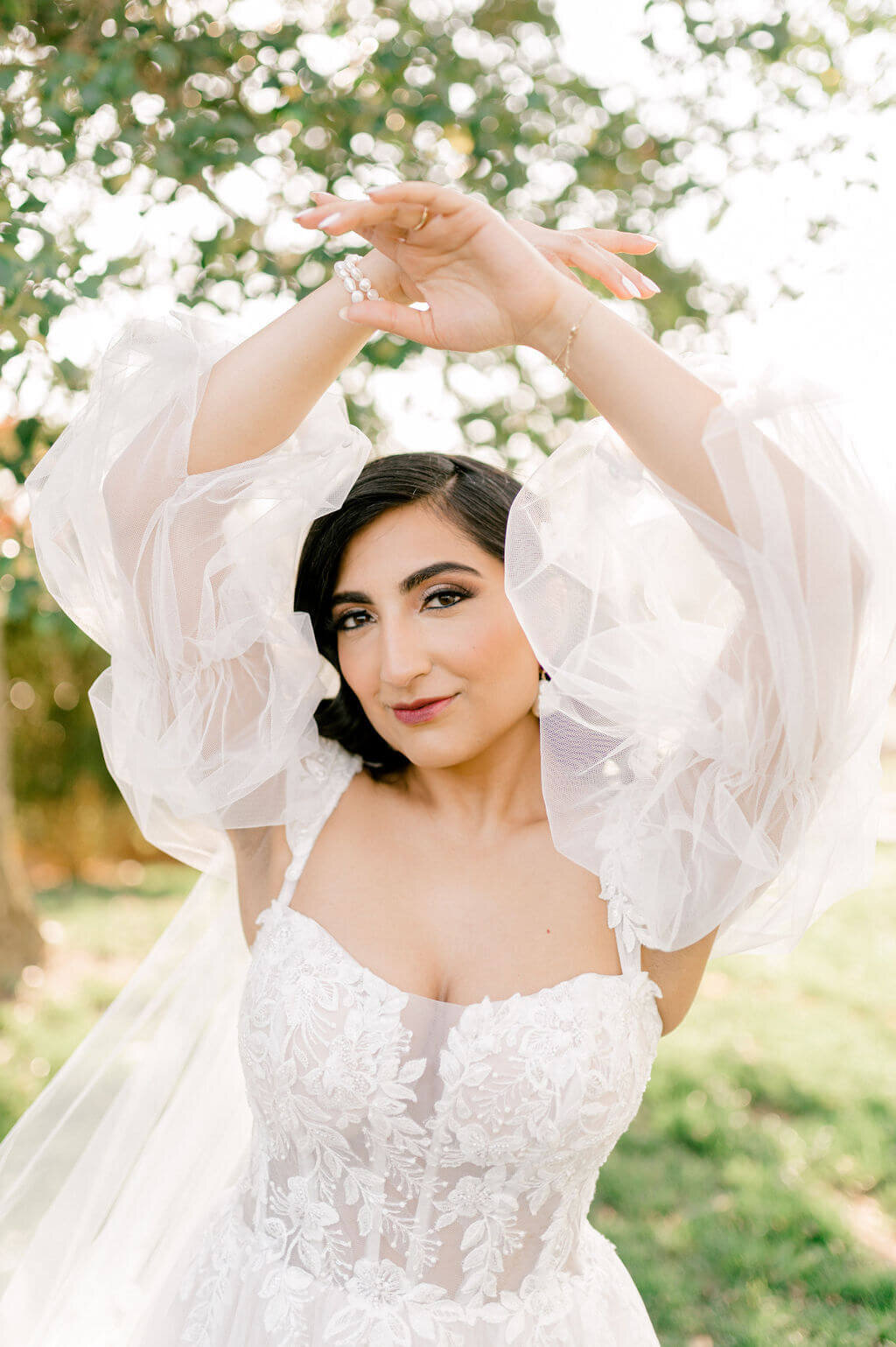 bridal portrait of bride wearing wedding dress with long sleeves