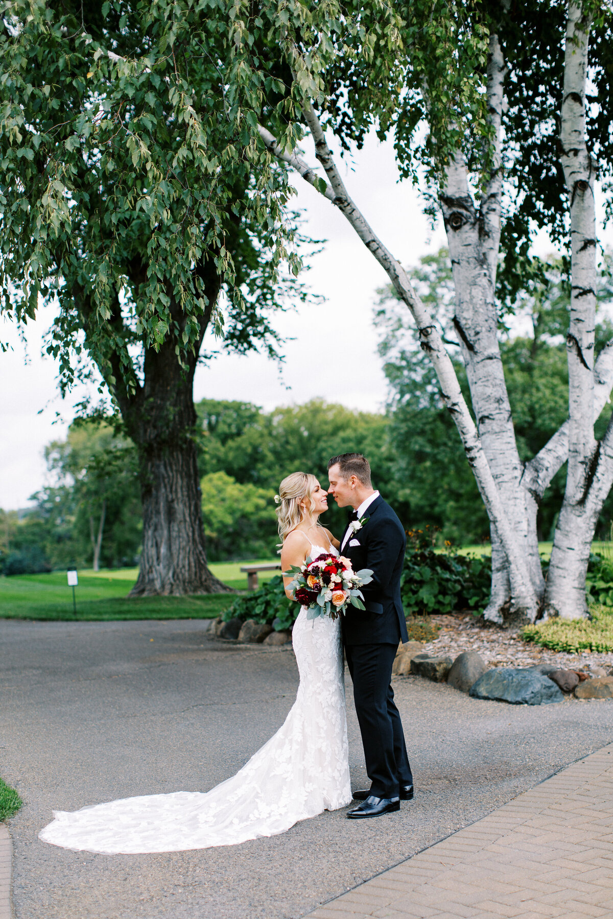 Bride and groom posing and touching noses