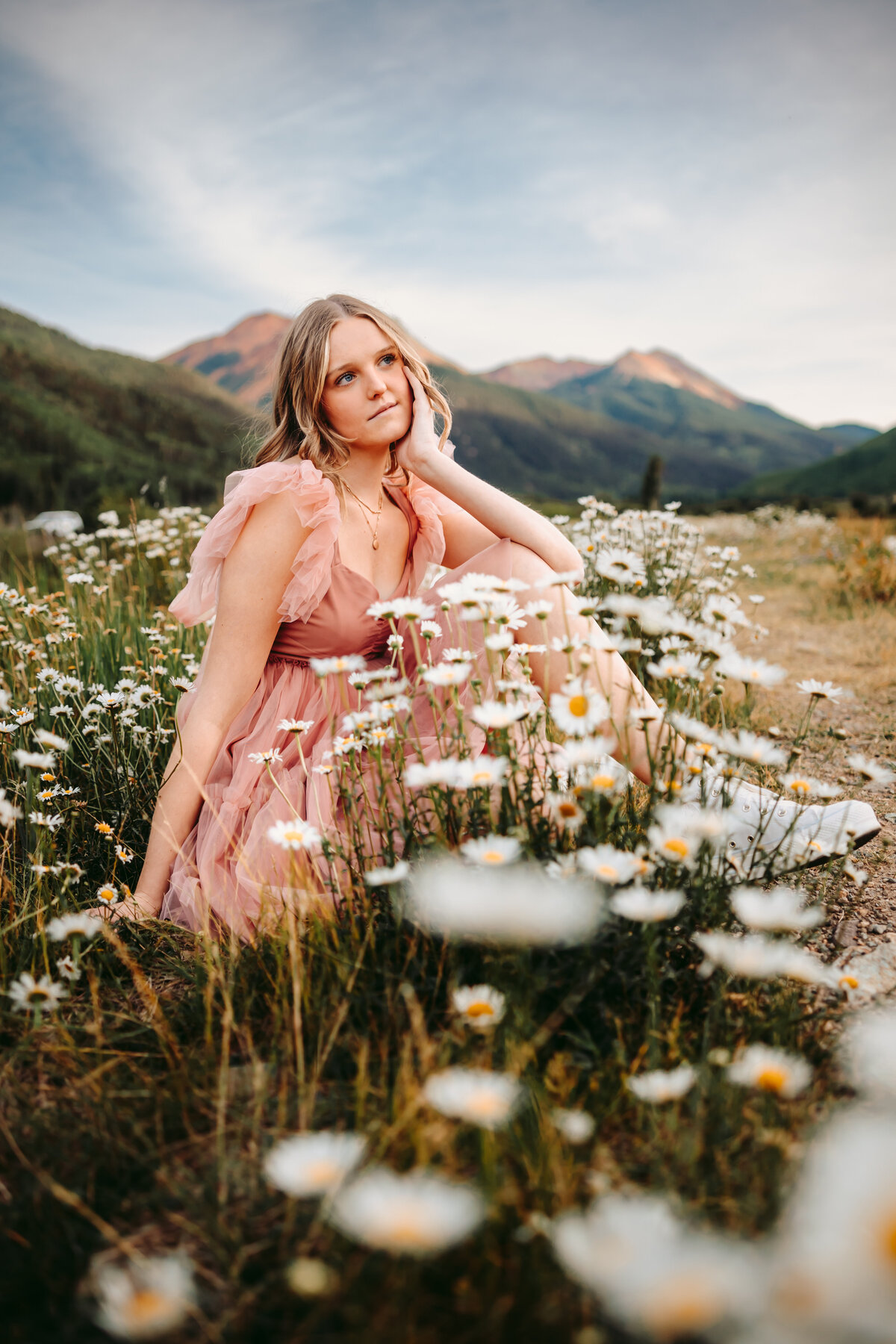 Allie poses in a field of wildflowers for her Montrose senior pictures.