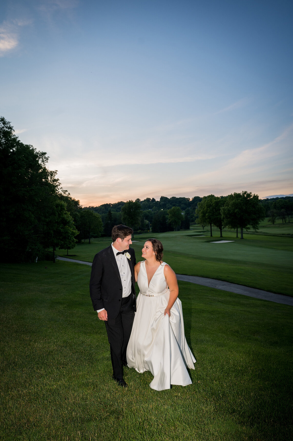 wedding pic of couple on the course at fox chapel golf club