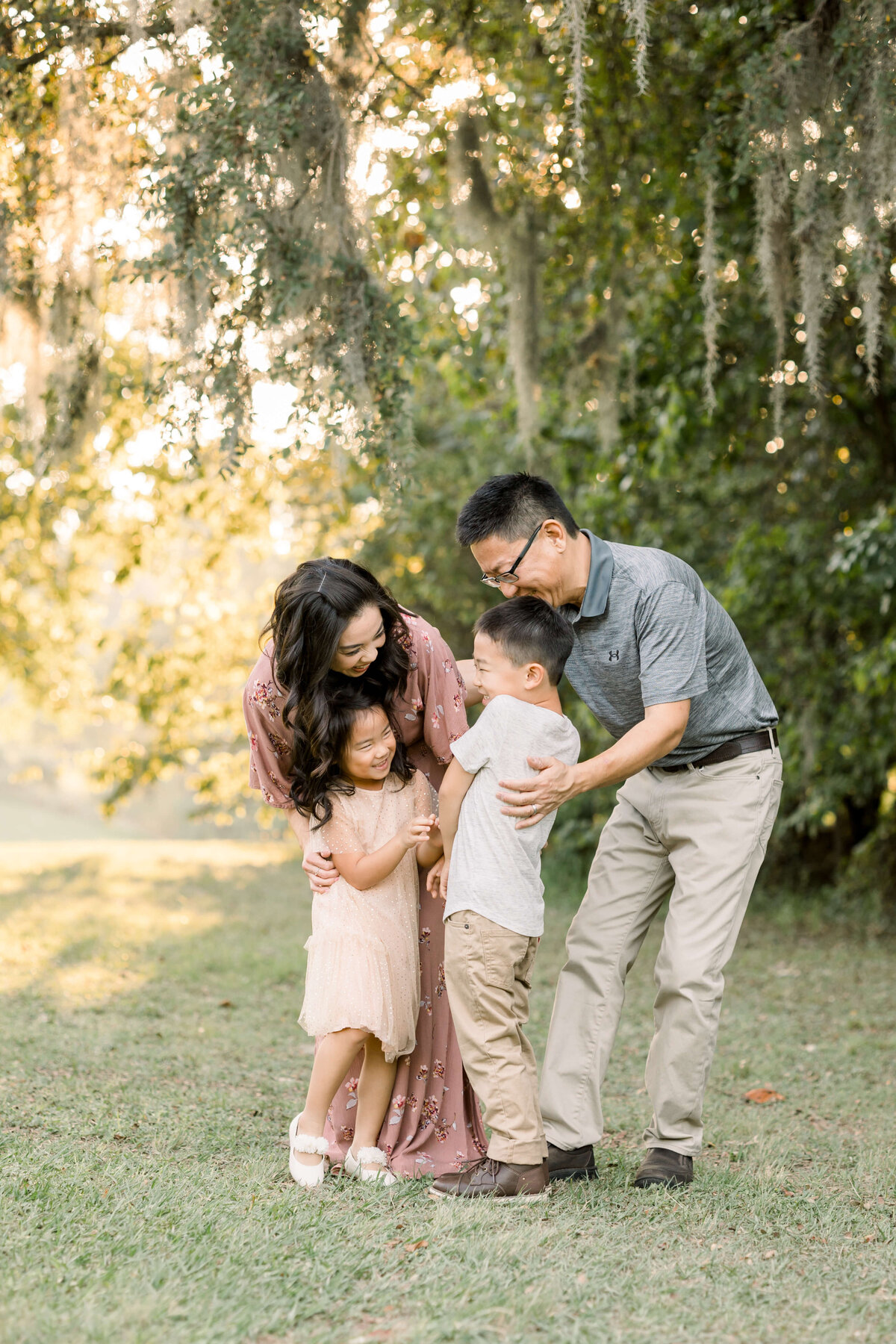 parents tickling their kids