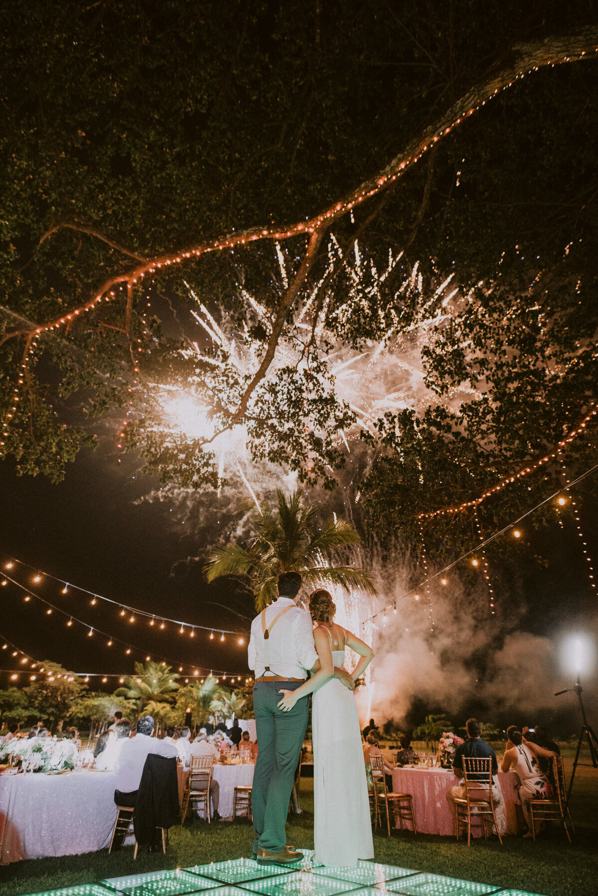 couple watching fireworks at wedding