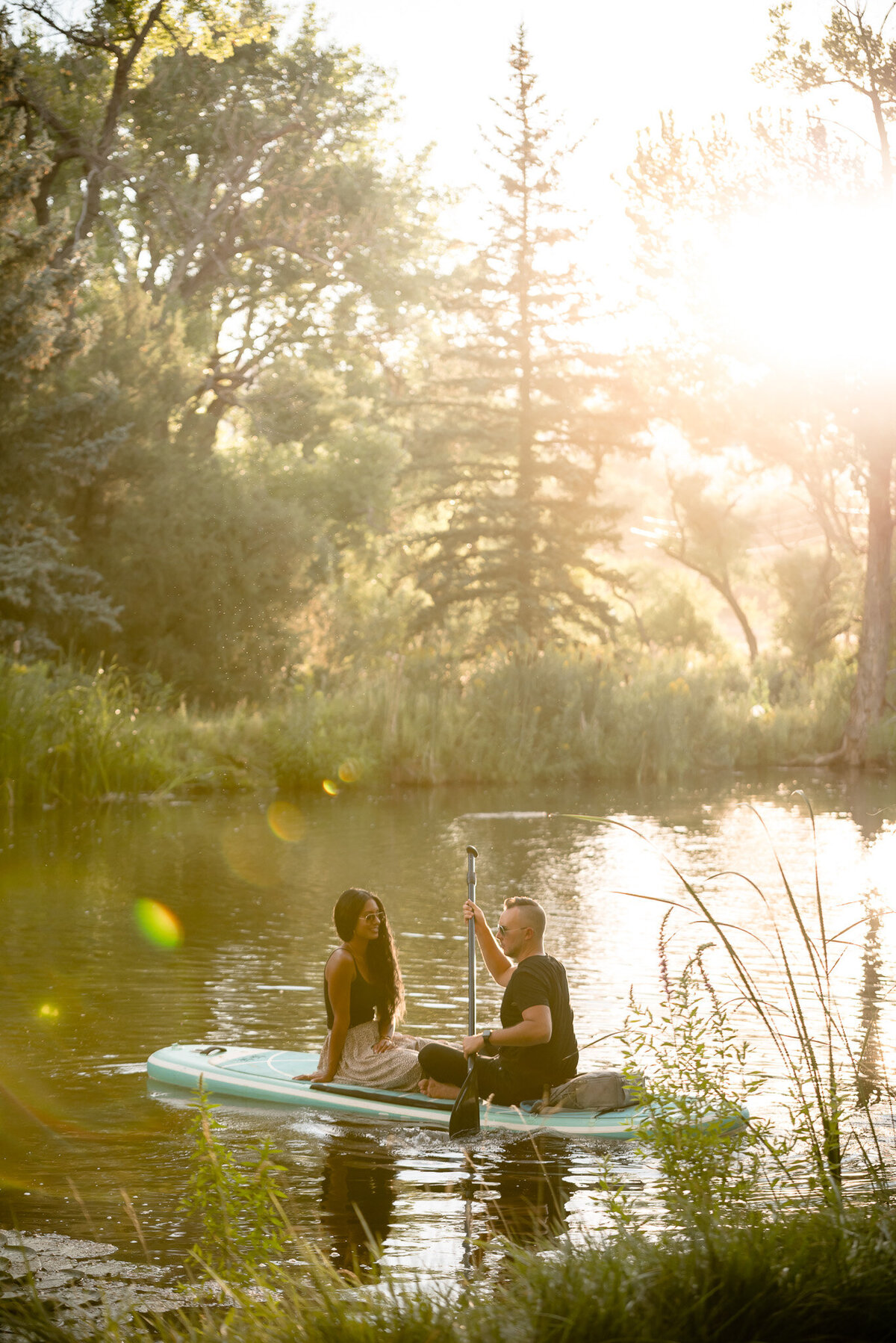 Colorado couple on a paddle board for a photography session