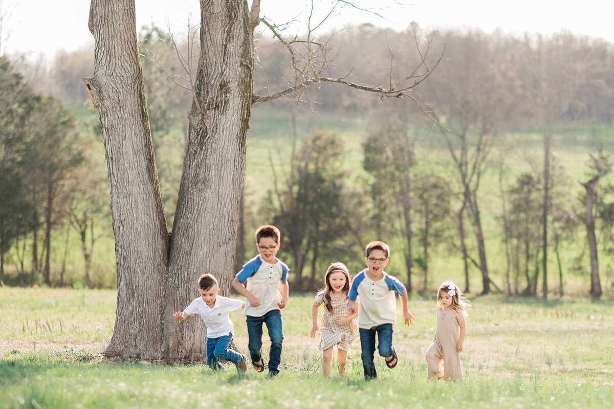 Grandkids racing through yard during family portrait session