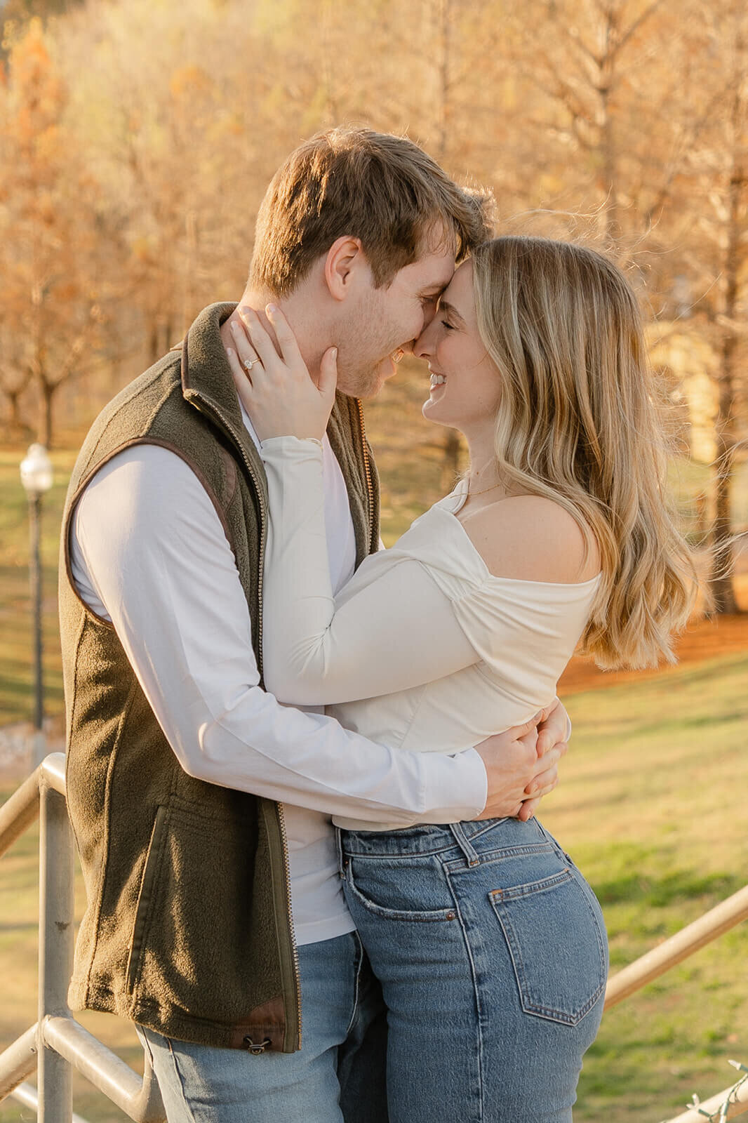 Couple embracing over looking fall trees
