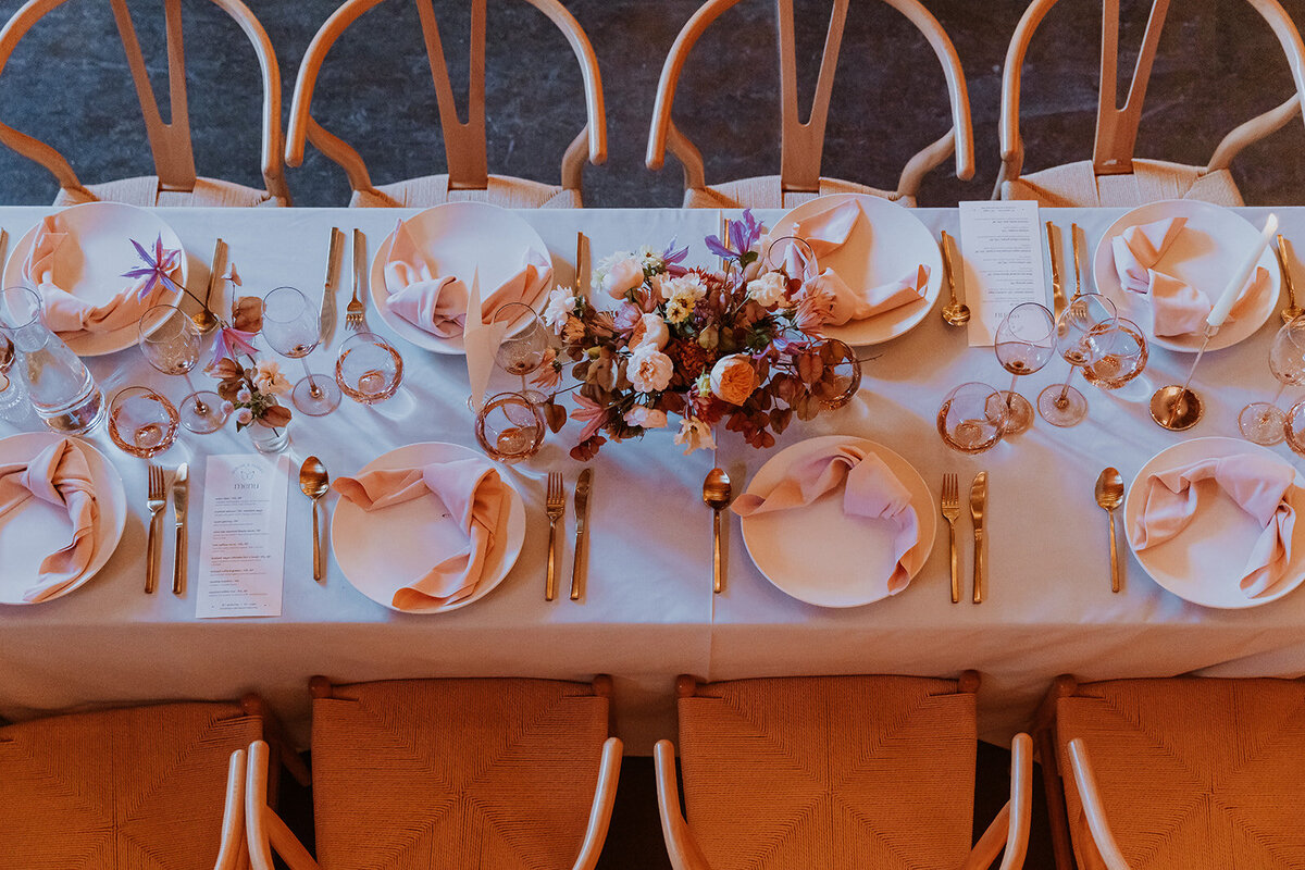 luxe long reception tables with centerpieces and budvases at olympia's valley estate napa