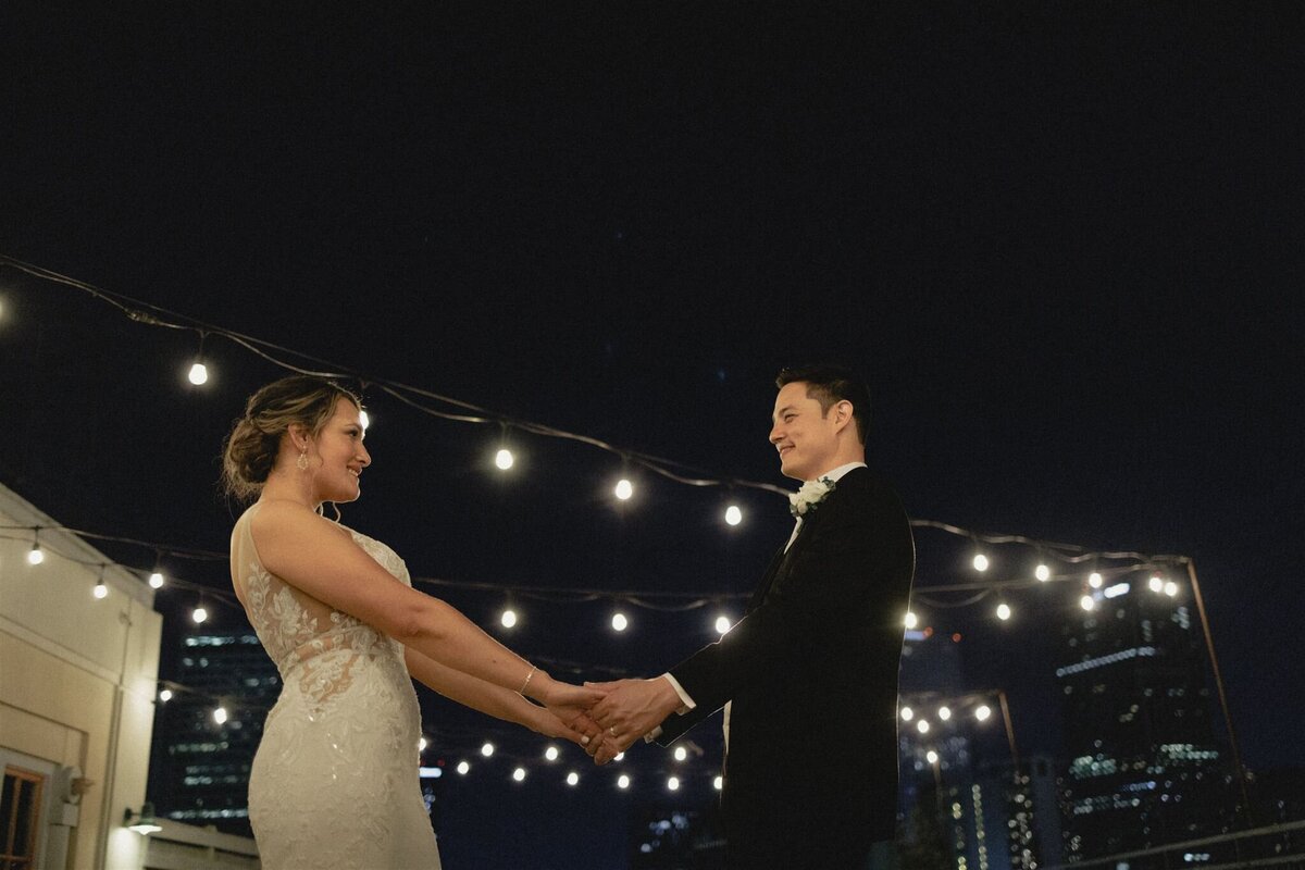 Newlyweds on rooftop in New Orleans