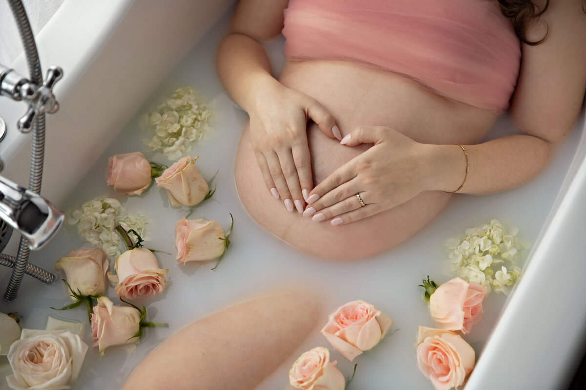 milk bath maternity photographer photoshoot pink roses floating with hydrangeas 