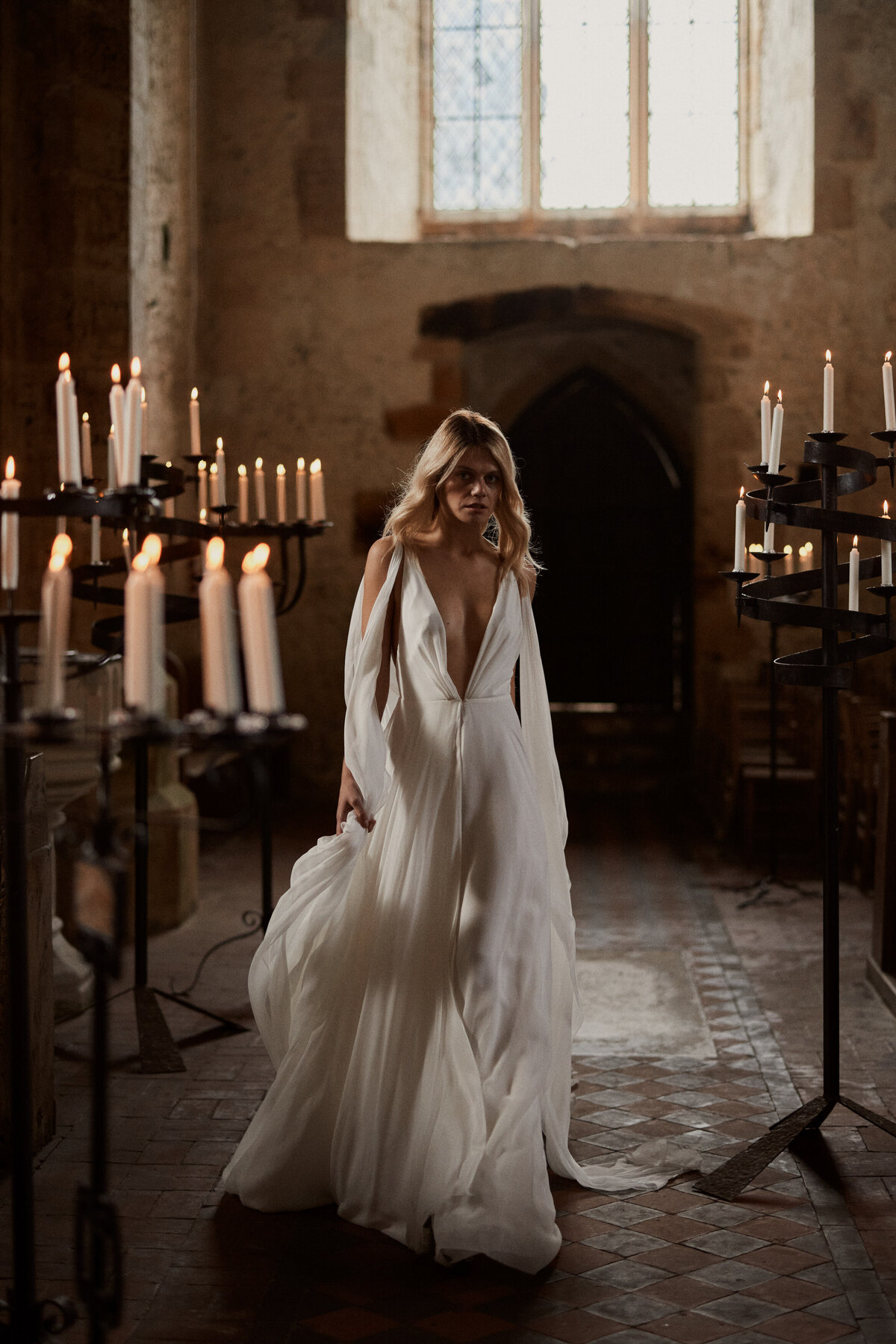 Deep v neck wedding dress in silk on bride in chapel wedding