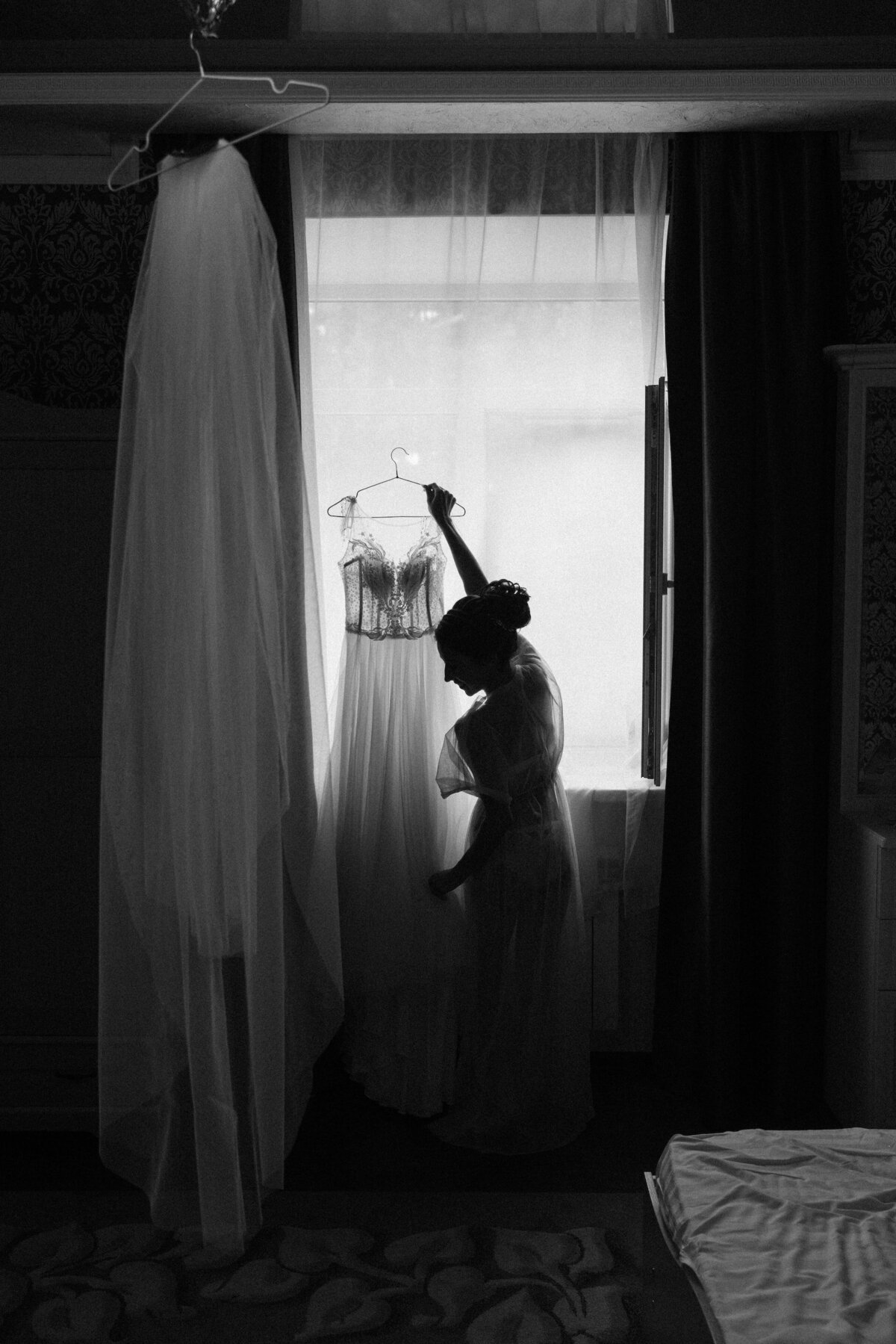 bride-holding-wedding-dress