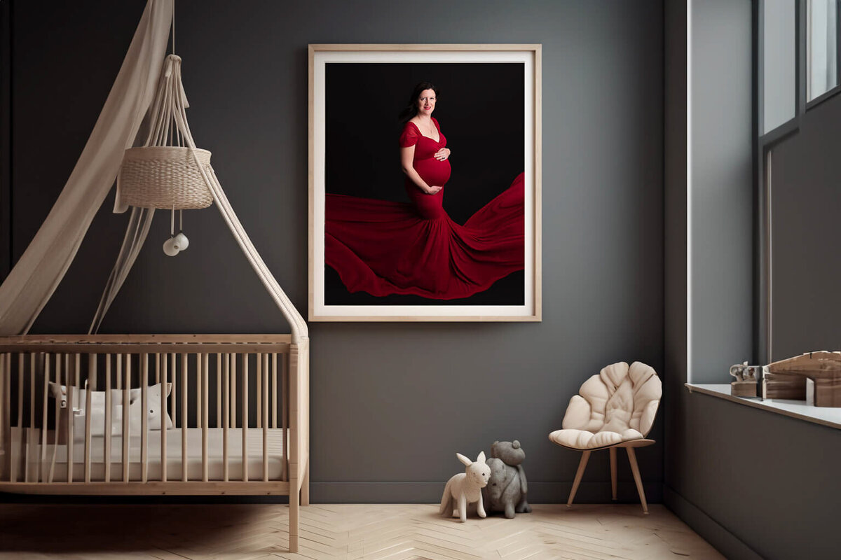 grey room with a woman wearing a red maternity dress for her Burlington, ON maternity photography session