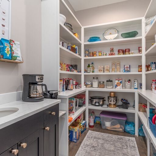A kitchen with a pantry and a sink