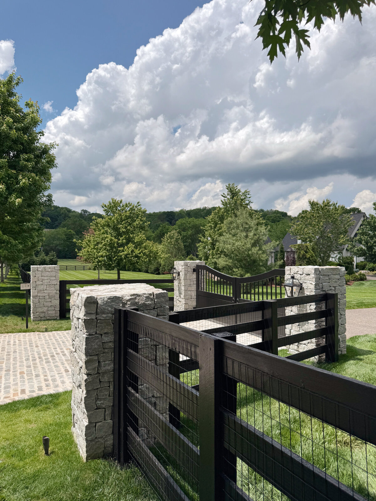 Custom Driveway Gate and stone Columns