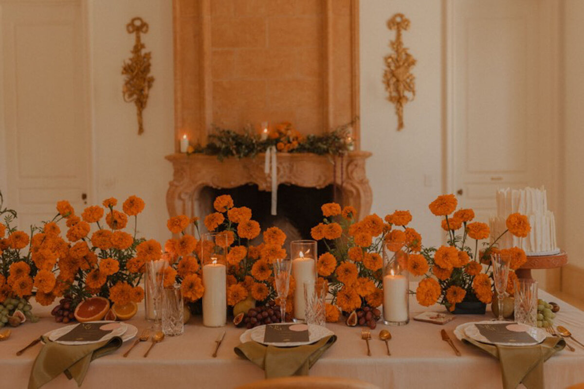 Orange flowers on reception table at North Carolina destination wedding