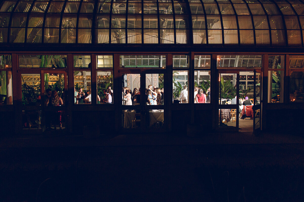 An external shot of a couple's reception at the Garfield Park Conservatory in Chicago