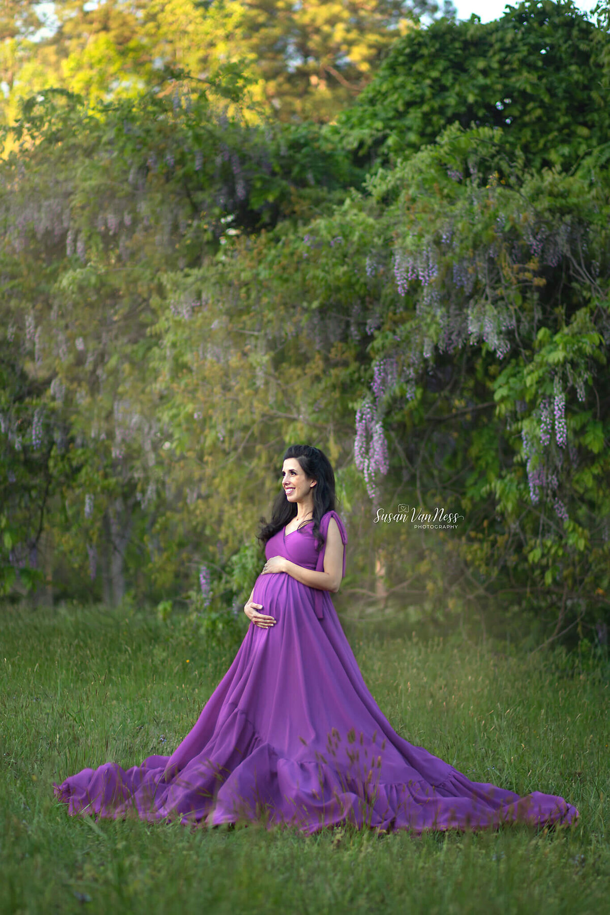 Expectant mother in wisteria by Susan VanNess Photography, a Raleigh maternity photographer