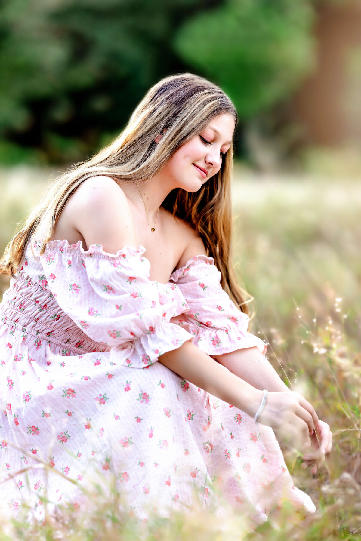 Side profile of high school senior girl laughing softly during Orlando senior session