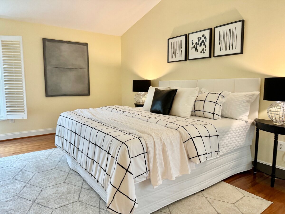 bedroom with black and white striped bedding
