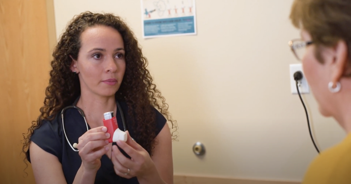 Hispanic women healthcare provider showing how to use inhaler recruiting video