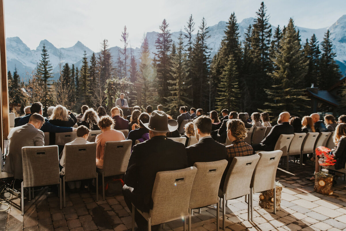 Beautiful outdoor wedding ceremony at The Malcolm Hotel, a modern romantic wedding venue in Canmore, featured on the Brontë Bride Vendor Guide.