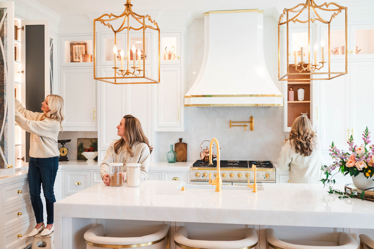 organization staff working in white kitchen prepping shelves