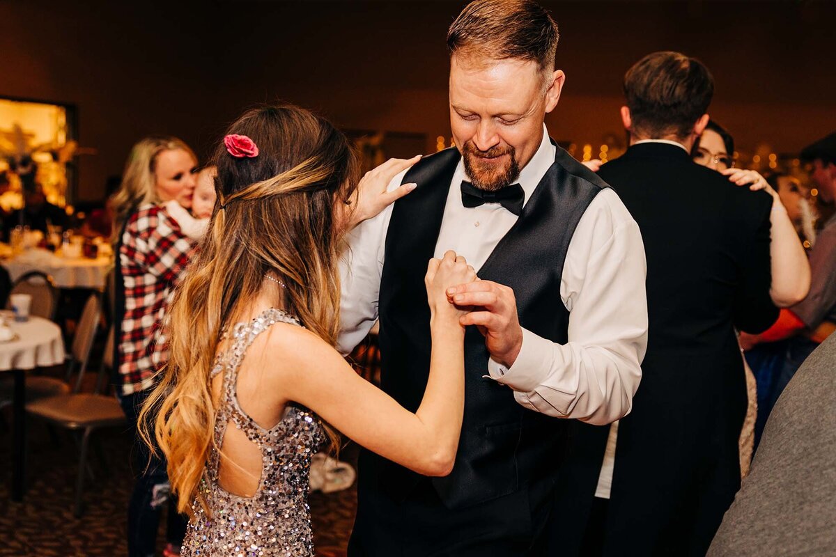 Father of bride dancing with bridesmaid at Broadway River Inn, Hamilton, MT