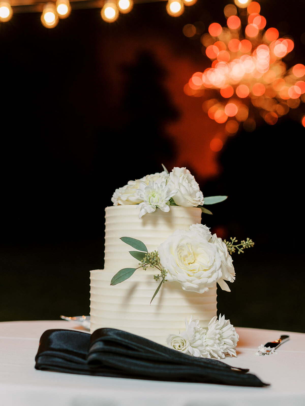 Cake shot with fireworks in the background
