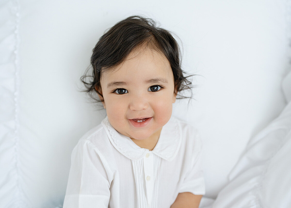 baby photographed for his sitting milestone in a brunswick photo studio