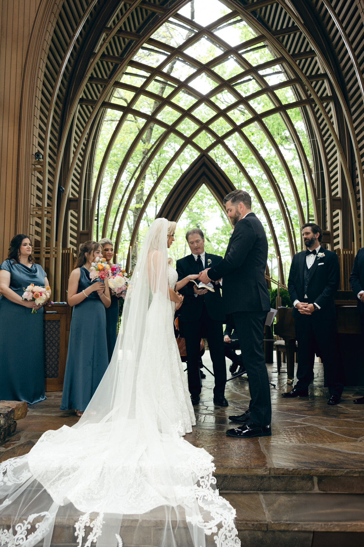 A wedding photo of the bride and groom on the alter at Anthony's Chapel in Hot Springs Arkansas