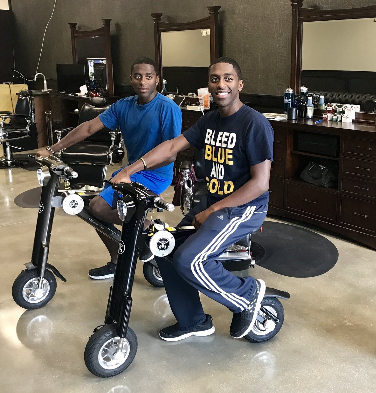 Twins in the barber shop on two Go-Bike M1