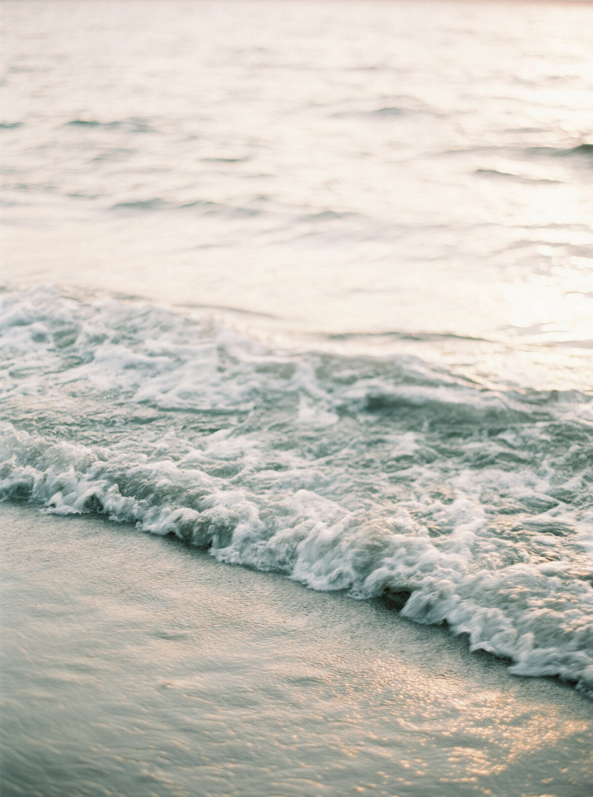 golden gardens waves crashing at engagement session