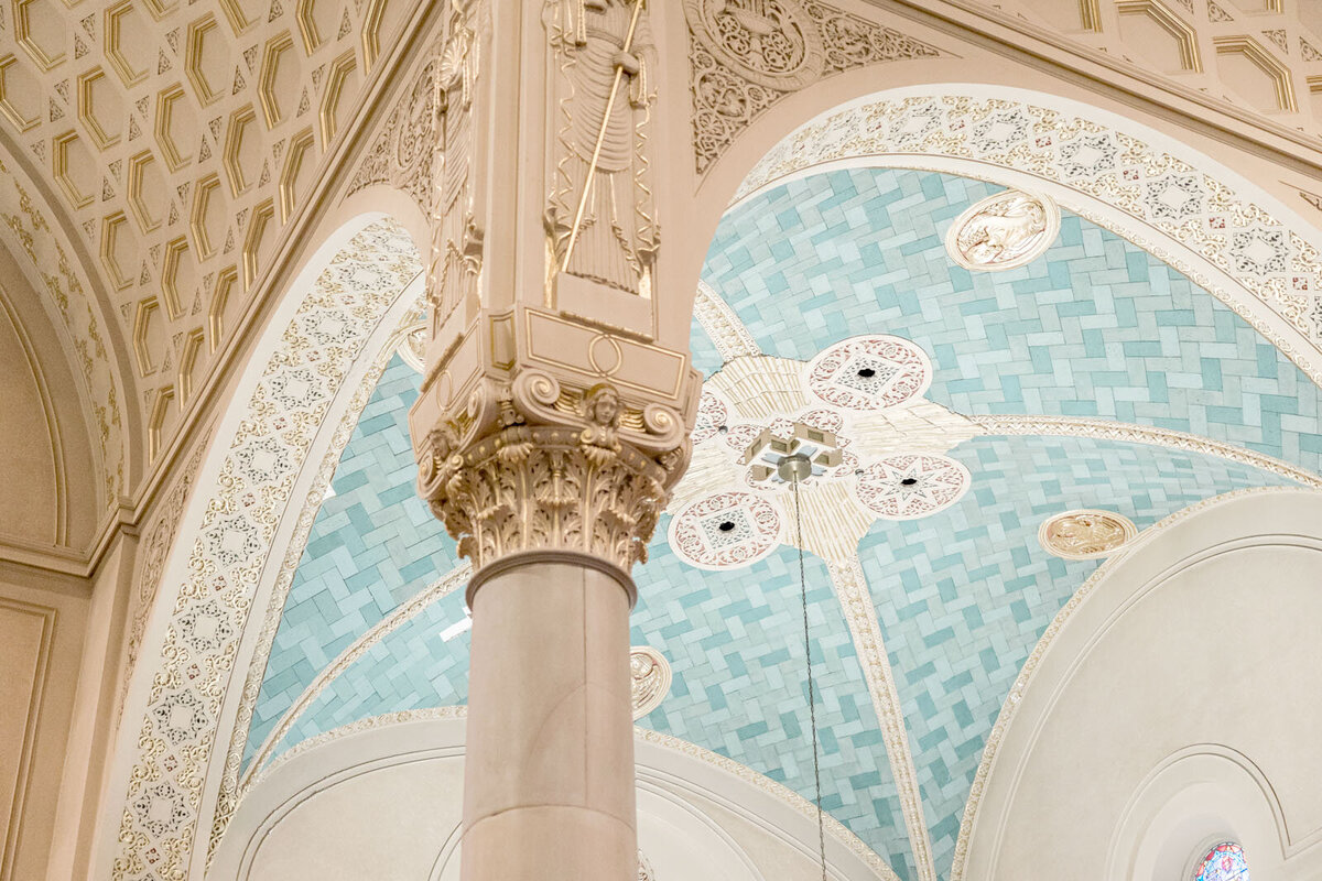 A close up of an opulent ceiling in a cathedral