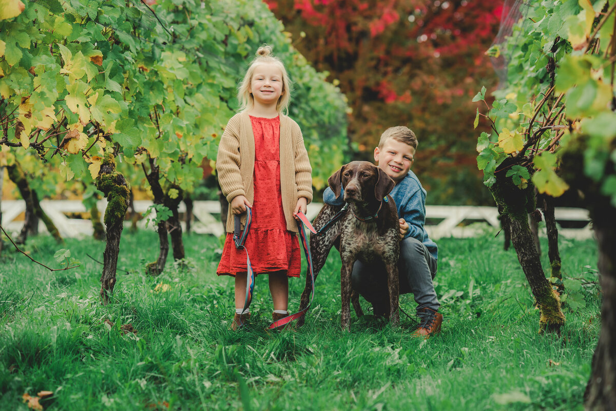 siblings and dog in fall colors