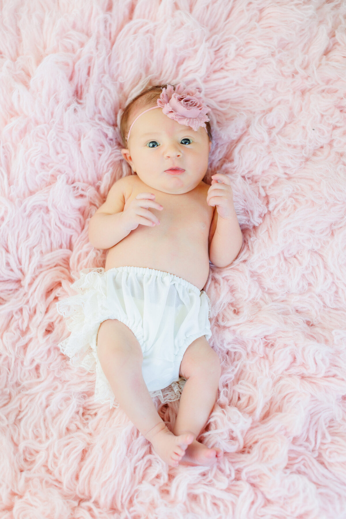 Baby girl on a pink background