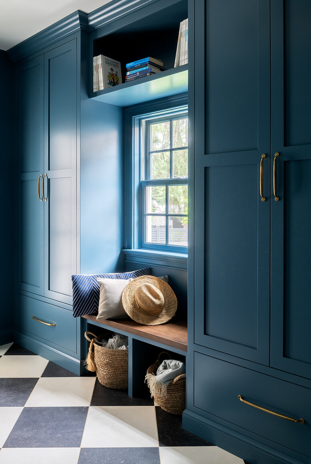 window seat with blue green cabinets